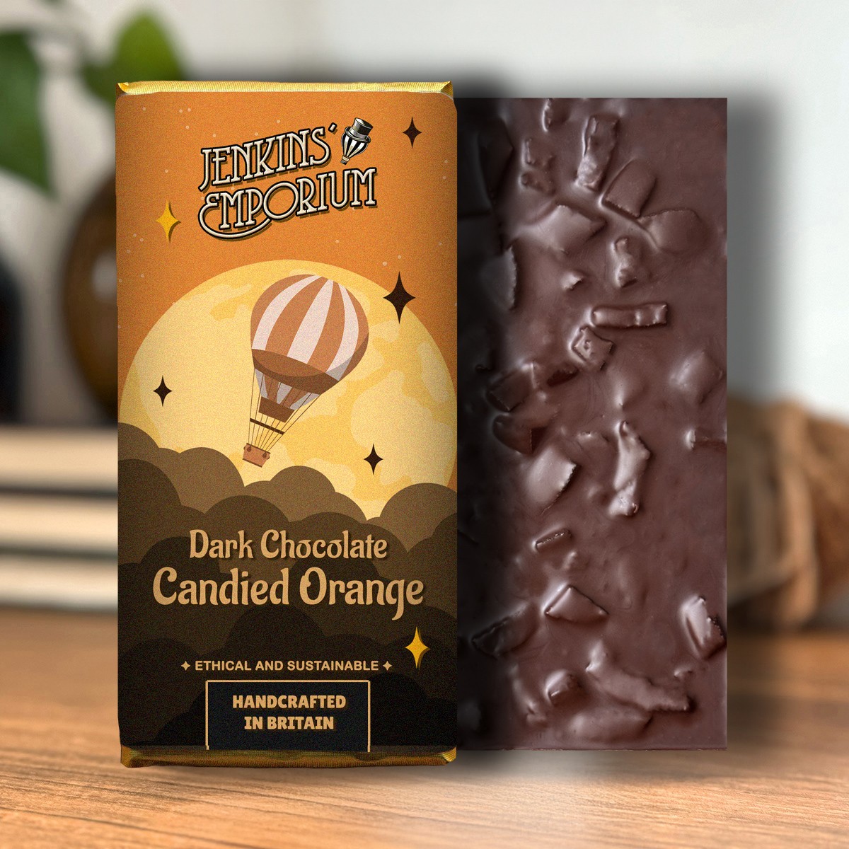 A dark chocolate bar filled with candied orange pieces
