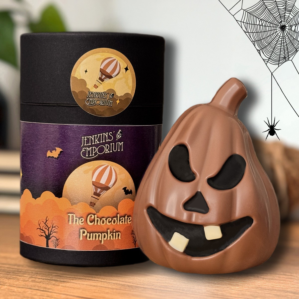 A spooky Milk chocolate pumpkin smilling